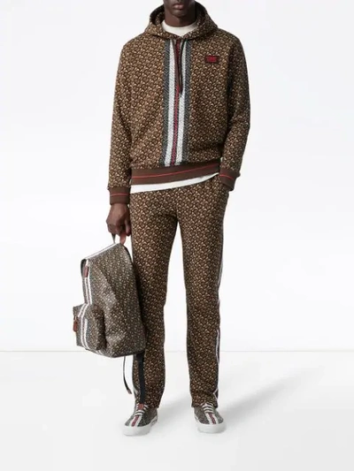 Shop Burberry Monogram Stripe Print Cotton Trackpants In Brown