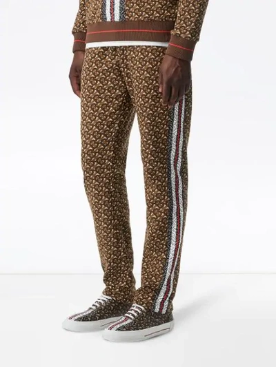 Shop Burberry Monogram Stripe Print Cotton Trackpants In Brown