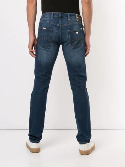 Shop Emporio Armani Slim Faded Jeans In Blue