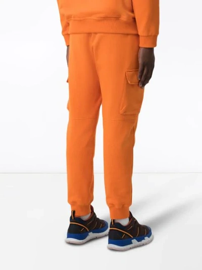 Shop Burberry Logo Patch Track Pants In Orange