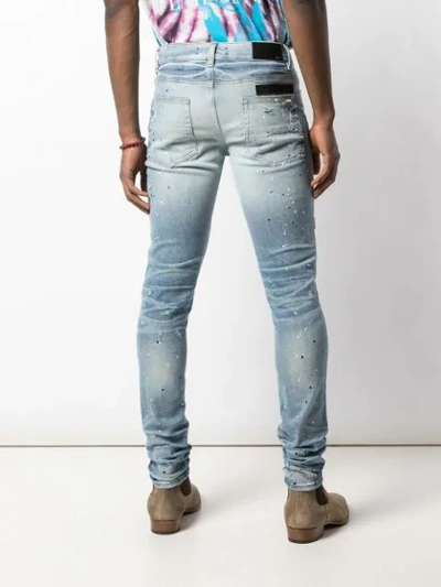 Shop Amiri Distressed Skinny Jeans In Blue