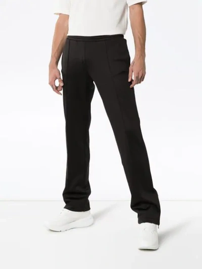 Shop Valentino Print Track Pants - Black