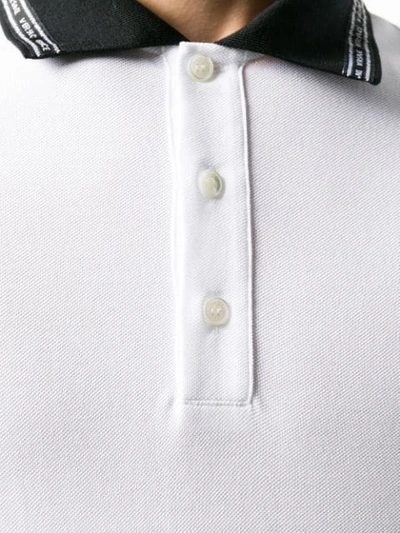 Shop Versace Logo Collar Polo Shirt In White
