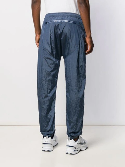 Shop Stone Island Logo Patch Track Trousers In Blue