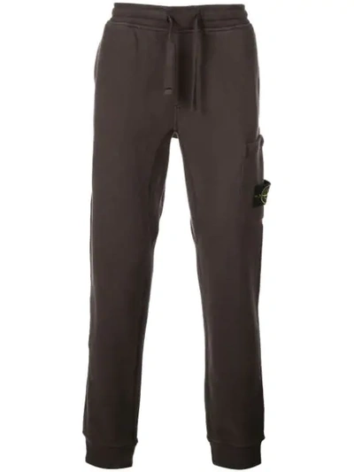 Shop Stone Island Track Pants With Logo Patch In Brown