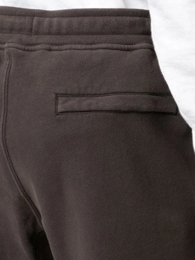 Shop Stone Island Track Pants With Logo Patch In Brown