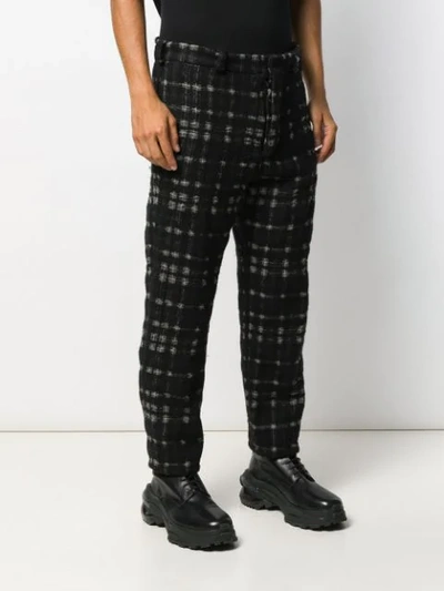 Shop Ann Demeulemeester Check Print Trousers In Black