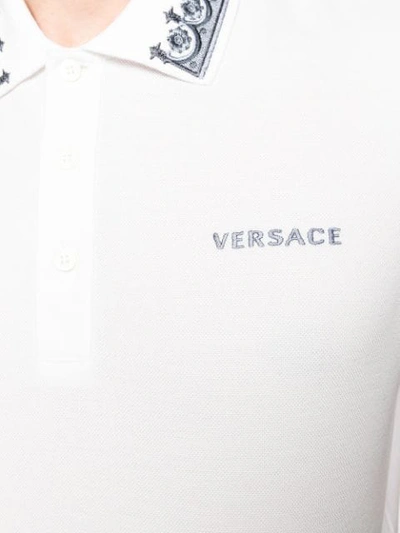 Shop Versace Contrasting Embroidery Polo Shirt In White
