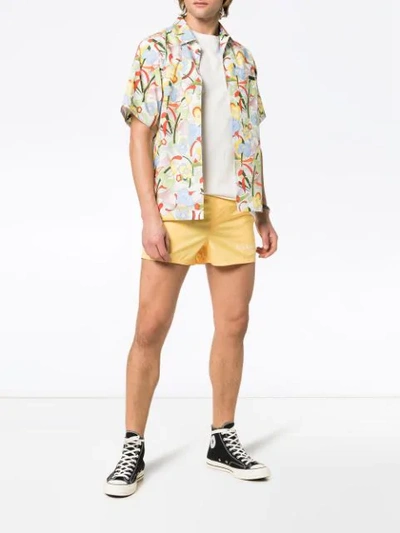 Shop Givenchy Logo Print Swim Shorts In Yellow