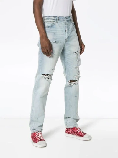 Shop Amiri Distressed Denim Jeans In Blue