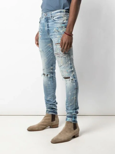 Shop Amiri Paint Splatter Skinny Jeans In Blue ,multicolour