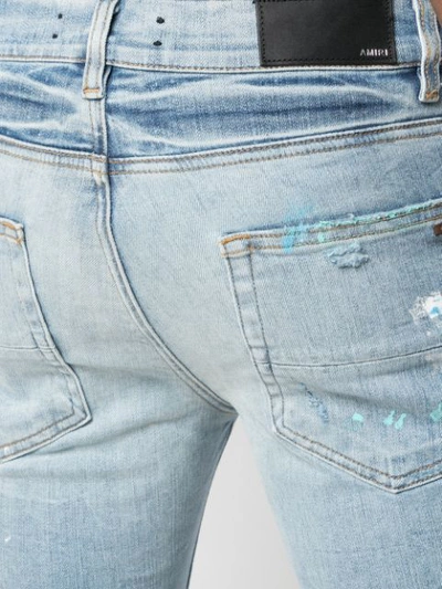 Shop Amiri Paint Splatter Skinny Jeans In Blue ,multicolour