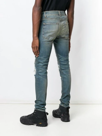 Shop Amiri Ripped Skinny Jeans In Blue