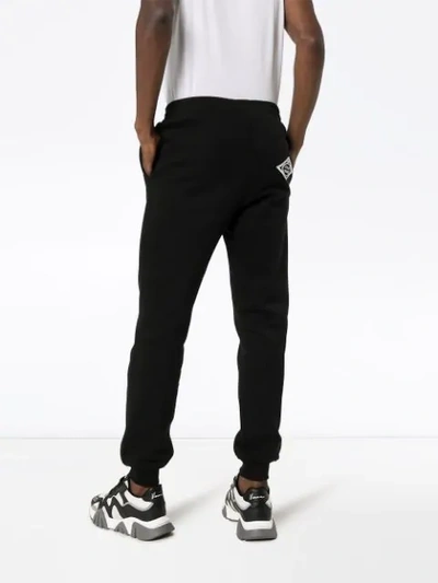 Shop Versace Logo Track Pants In Black