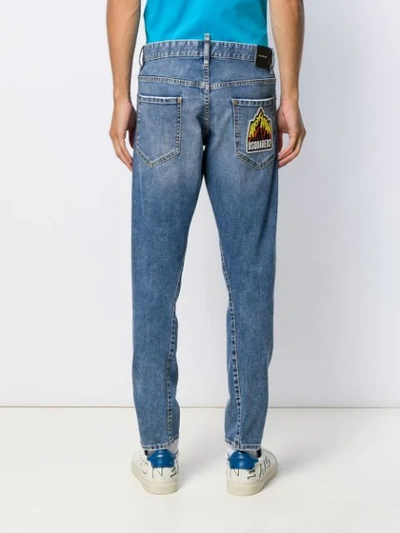 Shop Dsquared2 Logo Patch Tapered Jeans In Blue