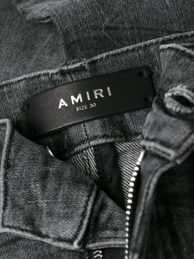 Shop Amiri Distressed Skinny Jeans In Black