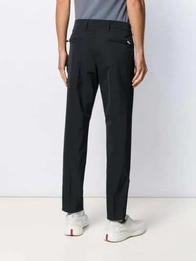 Shop Prada Zipped Ankle Tailored Trousers In Black