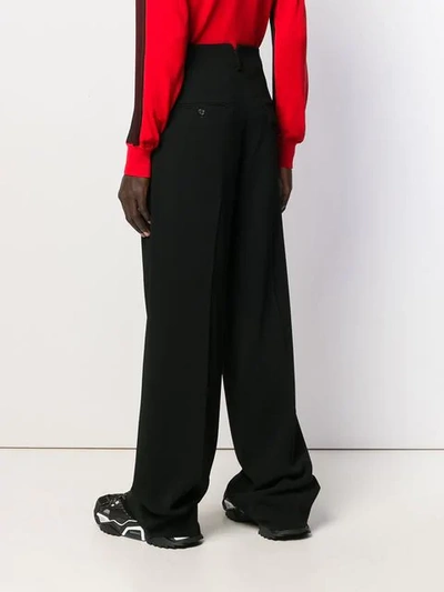 Shop Dsquared2 Wide Leg Pleated Trousers In Black