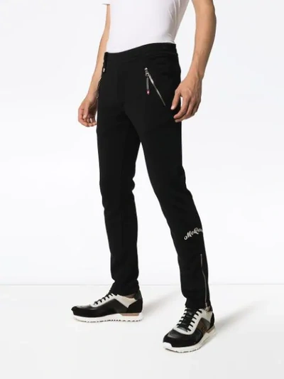Shop Alexander Mcqueen Zip Cuff Cotton Track Pants In Black