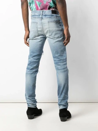 Shop Amiri Music Note Patch Jeans In Medium Crafted Indigo