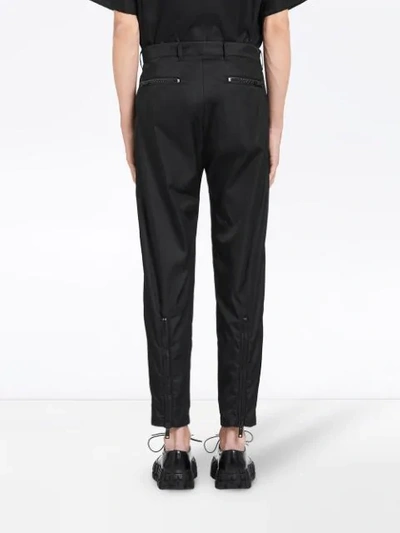 Shop Prada Zipper Detailed Casual Trousers In F0002 Nero