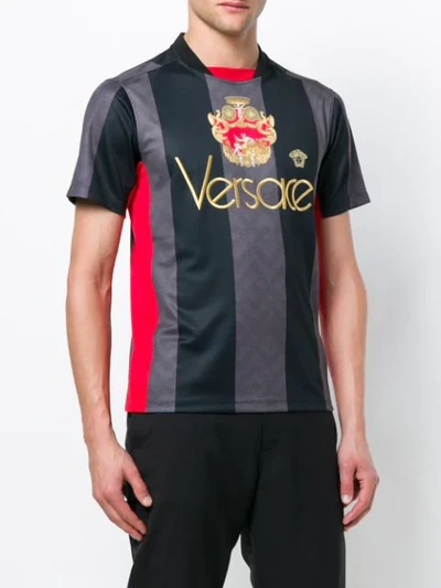 Shop Versace Logo Football Shirt In Black