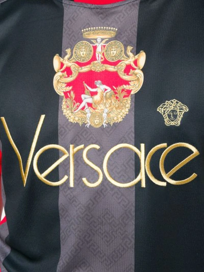 Shop Versace Logo Football Shirt In Black