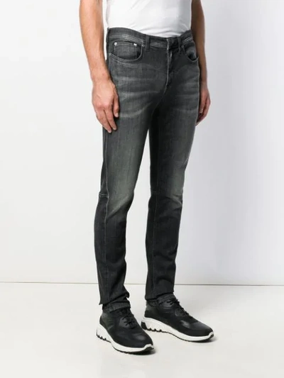 Shop Neil Barrett Faded Slim-fit Jeans In Black