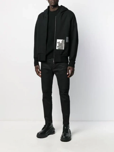 Shop Julius Zip Detailed Trousers In Black