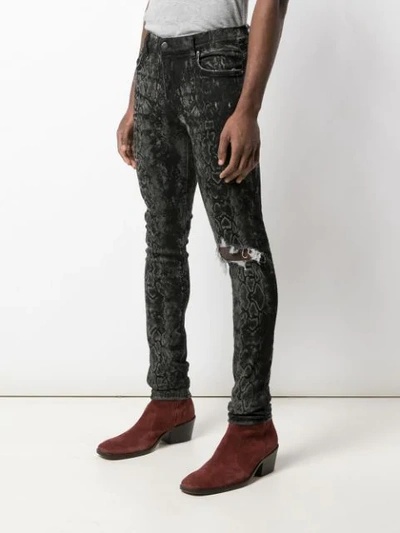 Shop Amiri Laser Snake Broken Skinny Jeans In Grey