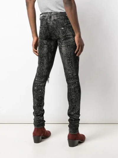 Shop Amiri Laser Snake Broken Skinny Jeans In Grey