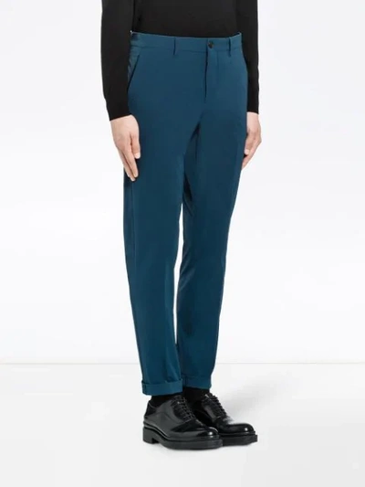 Shop Prada Light Stretch Techno Fabric Trousers In Blau