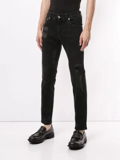 Shop Dolce & Gabbana Distressed Logo Jeans In Black