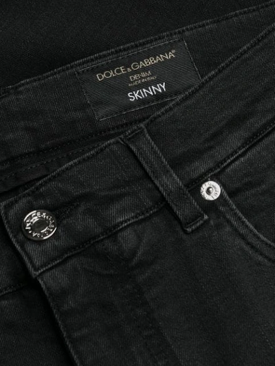 Shop Dolce & Gabbana Distressed Logo Jeans In Black