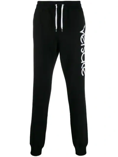 Shop Versace 90s Vintage Logo Track Pants In Black