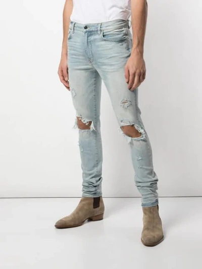 Shop Amiri Trasher Skinny Jeans In Blue