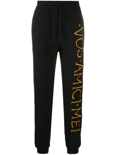 Shop Moschino Embroidered Logo Track Pants In Black