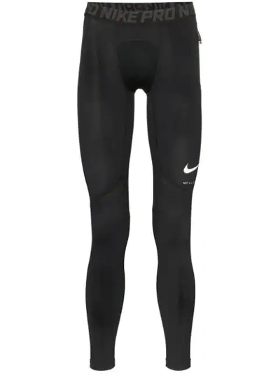 Shop Nike Logo Print Leggings In Black