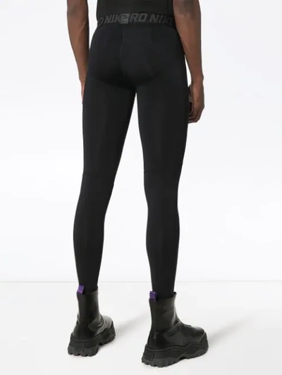 Shop Nike Logo Print Leggings In Black