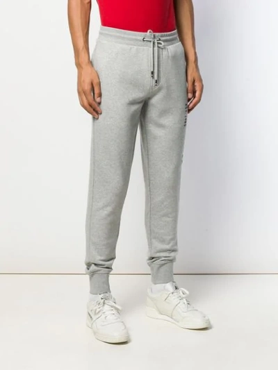 Shop Tommy Hilfiger Embroidered Logo Track Pants In Grey