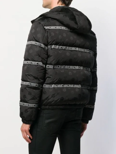 Shop Versace Logo Stripes Puffer Jacket In A408 Black