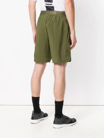 Shop Nike Loose Fitted Shorts  In Green