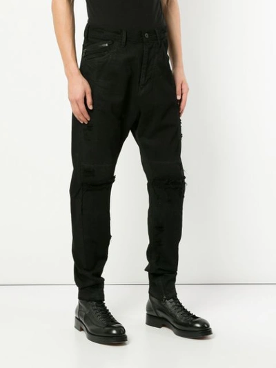 Shop Julius Distressed Straight Jeans In Black