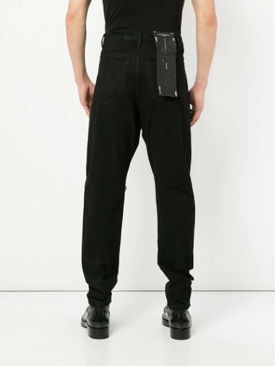 Shop Julius Distressed Straight Jeans In Black