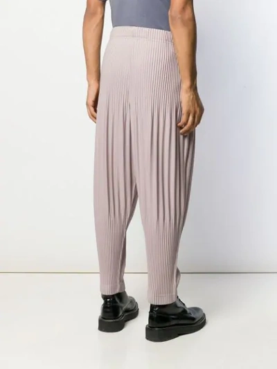 Shop Issey Miyake Pleated Dropped Crotch Trousers In Pink