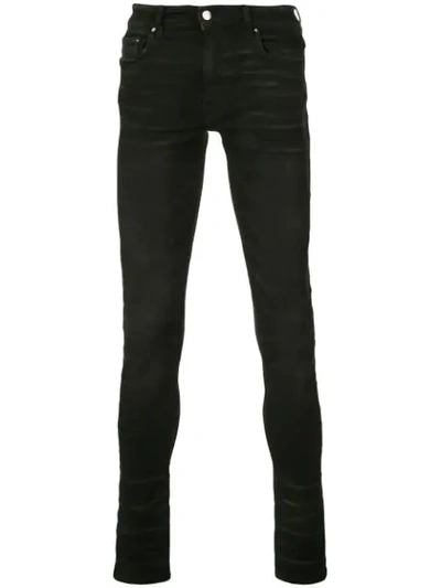 Shop Amiri Stack Skinny Jeans In Black