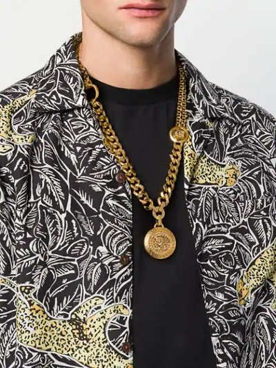 Shop Versace Embellished Medusa Pendant Necklace In Gold