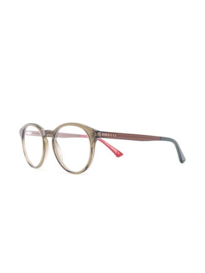 Shop Gucci Oval Framed Glasses In Green