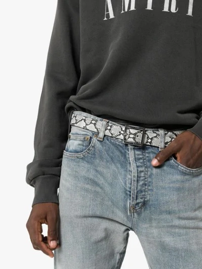 Shop Amiri Snake Embossed Buckled Belt In Black