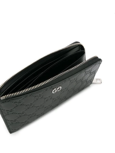 Shop Gucci Signature Zip-around Wallet In Black